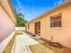 Exterior view showcasing the well-maintained backyard with a sliding door and patio at 1711 Francisco St, The Villages, FL 32159