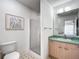 Bathroom featuring a shower, toilet, and a vanity with a sink at 1711 Francisco St, The Villages, FL 32159