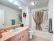 Bathroom featuring a shower-tub combo, toilet, and vanity with a sink at 1711 Francisco St, The Villages, FL 32159