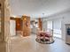 The dining area is well-lit and flows into the living area with tile floors and access to the outdoors at 1711 Francisco St, The Villages, FL 32159