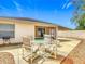 Inviting patio space with outdoor table and chairs, perfect for al fresco dining at 1711 Francisco St, The Villages, FL 32159