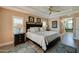 This bedroom features a trey ceiling, plantation shutters, and an ensuite bathroom at 1792 Arash Cir, Port Orange, FL 32128