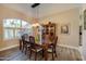 Formal dining room features an elegant light fixture and wood floors at 1792 Arash Cir, Port Orange, FL 32128