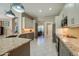Modern kitchen featuring granite countertops, stainless steel appliances, and ample cabinet space at 1792 Arash Cir, Port Orange, FL 32128