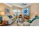 Cozy living room with comfortable seating and a decorative quilt on the wall at 1792 Arash Cir, Port Orange, FL 32128