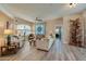 Comfortable living room featuring a ceiling fan and decorative quilt at 1792 Arash Cir, Port Orange, FL 32128