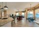 Open-concept living room with fireplace and breakfast nook features wood floors at 1792 Arash Cir, Port Orange, FL 32128