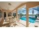 Relaxing screened-in lanai with a private pool and peaceful lake views for outdoor enjoyment at 1792 Arash Cir, Port Orange, FL 32128