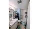 Cozy bathroom features a shower-tub combination with tiled walls and storage shelves for toiletries at 190 Hickory Woods Ct # 15C, Deltona, FL 32725