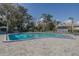 Enjoy this sparkling pool on a sunny day, surrounded by brick pavers, ample seating, and shade umbrellas at 190 Hickory Woods Ct # 15C, Deltona, FL 32725
