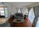 Cozy living room with hardwood floors, comfortable seating, and ample natural light at 190 Hickory Woods Ct # 15C, Deltona, FL 32725