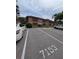 Exterior shot of the building showing unit parking, with well-defined parking spaces available at 190 Hickory Woods Ct # 15C, Deltona, FL 32725