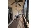 The enclosed patio includes ceiling fans, sunshades, and outside views at 190 Hickory Woods Ct # 15C, Deltona, FL 32725
