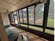 Enclosed patio with windows surrounding the perimeter, ceiling fans and access to the outside at 190 Hickory Woods Ct # 15C, Deltona, FL 32725