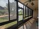 The enclosed patio features windows, screens, exterior views and ceiling fans at 190 Hickory Woods Ct # 15C, Deltona, FL 32725