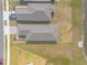Birds eye view of new homes with modern roofs, landscaping, and driveway parking at 207 Pitching Wedge Dr, Daytona Beach, FL 32124