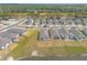 New construction homes overlooking a lake feature manicured lawns and modern designs at 207 Pitching Wedge Dr, Daytona Beach, FL 32124