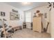 Inviting bedroom featuring neutral carpet, natural light from a window, and unique decor elements for a cozy atmosphere at 207 Pitching Wedge Dr, Daytona Beach, FL 32124