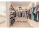 Spacious walk-in closet with ample shelving and racks, providing plenty of storage space for clothes and accessories at 207 Pitching Wedge Dr, Daytona Beach, FL 32124