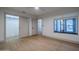 A clean bedroom featuring wood-look floors, a window and a closet at 210 Sage Brush Trl, Ormond Beach, FL 32174