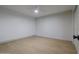 A bright, empty bedroom with wood-look floors and a ceiling fan at 210 Sage Brush Trl, Ormond Beach, FL 32174