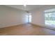 Bright bedroom featuring natural light, wood-look floors and fresh decor at 210 Sage Brush Trl, Ormond Beach, FL 32174