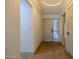 Bright foyer featuring hardwood floors and a large front door with sidelights at 210 Sage Brush Trl, Ormond Beach, FL 32174