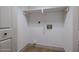 A laundry room with shelving and hookups at 210 Sage Brush Trl, Ormond Beach, FL 32174