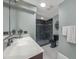 Modern bathroom featuring a walk-in shower, updated vanity, lighting and hardware at 2149 Hontoon Rd, Deland, FL 32720