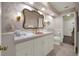 Bathroom featuring floral wallpaper, a decorative mirror, and a pink countertop sink at 2149 Hontoon Rd, Deland, FL 32720