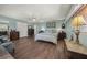 Spacious bedroom featuring natural light, wood floors, a ceiling fan, and ample closet space at 2149 Hontoon Rd, Deland, FL 32720