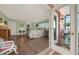 Open view of bedroom, revealing decor, and sliding glass doors to the outside area at 2149 Hontoon Rd, Deland, FL 32720