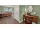 Comfortable bedroom with an antique desk and chair at 2149 Hontoon Rd, Deland, FL 32720
