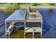 Detailed aerial shot of a well-equipped boat dock, offering easy access to the river and outdoor enjoyment at 2149 Hontoon Rd, Deland, FL 32720