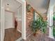 Home's entrance with brick porch, columns, and wood flooring at 2149 Hontoon Rd, Deland, FL 32720