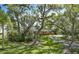 A single story home behind a long driveway lined with mature trees at 2149 Hontoon Rd, Deland, FL 32720