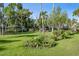 Well-maintained house on a vast lawn with mature landscaping, creating a serene and private setting at 2149 Hontoon Rd, Deland, FL 32720