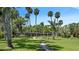 Spacious property featuring a long, low-set house nestled among lush trees and a charming stone pathway at 2149 Hontoon Rd, Deland, FL 32720