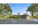 Stunning single-story home with lush landscaping, a circular driveway, and a convenient attached garage at 2149 Hontoon Rd, Deland, FL 32720