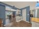Open-concept kitchen and dining area with stainless steel appliances and views of the backyard and pool at 2149 Hontoon Rd, Deland, FL 32720