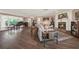 Inviting living room with a fireplace, rich hardwood floors, and stylish furnishings at 2149 Hontoon Rd, Deland, FL 32720