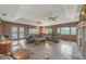 Expansive living room with a fireplace, tile flooring, and patio access to a pool area at 2149 Hontoon Rd, Deland, FL 32720