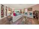 Comfortable living room with a fireplace, and plush sofas and a stylish glass coffee table at 2149 Hontoon Rd, Deland, FL 32720