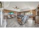 Large living room with a fireplace, paneled walls, and comfortable seating areas at 2149 Hontoon Rd, Deland, FL 32720