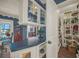Well-stocked walk-in pantry with shelves and cabinets and counter overlooking breakfast nook at 2149 Hontoon Rd, Deland, FL 32720