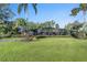 Attractive pool and screened enclosure surrounded by lush landscaping, providing a private and relaxing outdoor space at 2149 Hontoon Rd, Deland, FL 32720