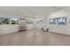 Bright and airy room with tiled floor, multiple windows, and lake views at 2149 Hontoon Rd, Deland, FL 32720