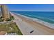 Scenic aerial view of a pristine beach next to a high-rise condo at 2200 N Atlantic Ave # 1201, Daytona Beach, FL 32118