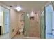 Stylish bathroom featuring a toilet, decor, and glass-enclosed shower with tile surround at 2200 N Atlantic Ave # 1201, Daytona Beach, FL 32118
