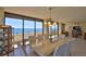 Bright dining area with ocean views and an open layout to the living room at 2200 N Atlantic Ave # 1201, Daytona Beach, FL 32118